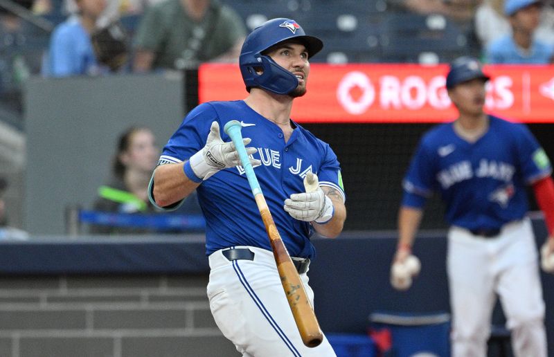 Jul 2, 2024; Toronto, Ontario, CAN;  Toronto Blue Jays second baseman Spencer Horwitz (48) hits a solo home run against the Houston Astros in the third inning at Rogers Centre. Mandatory Credit: Dan Hamilton-USA TODAY Sports