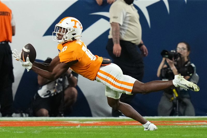 Dec 30, 2022; Miami Gardens, FL, USA; Tennessee Volunteers wide receiver Squirrel White (10) makes a catch during the first half of the 2022 Orange Bowl against the Clemson Tigers at Hard Rock Stadium. Mandatory Credit: Jasen Vinlove-USA TODAY Sports