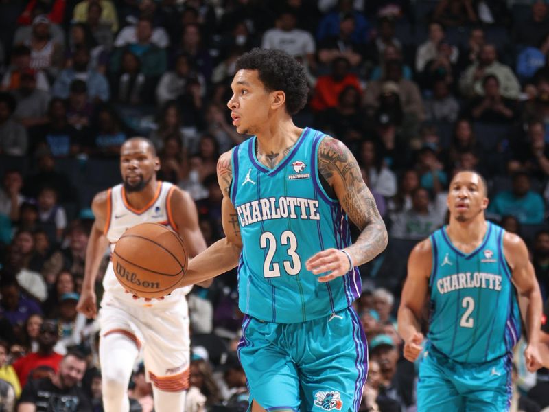 CHARLOTTE, NC - MARCH 15:  Tre Mann #23 of the  Charlotte Hornets handles the ball during the game  on March 15, 2024 at Spectrum Center in Charlotte, North Carolina. NOTE TO USER: User expressly acknowledges and agrees that, by downloading and or using this photograph, User is consenting to the terms and conditions of the Getty Images License Agreement.  Mandatory Copyright Notice:  Copyright 2024 NBAE (Photo by Nathaniel S. Butler/NBAE via Getty Images)