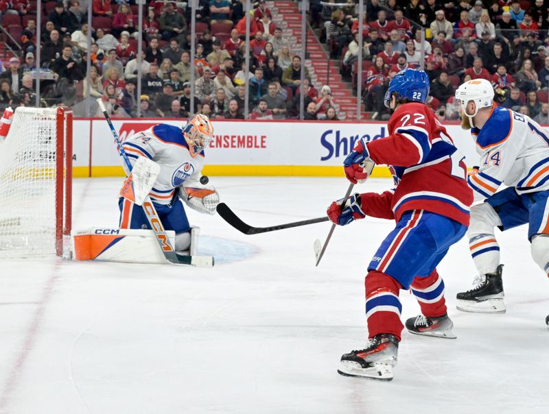 Jan 13, 2024; Montreal, Quebec, CAN; Edmonton Oilers goalie Stuart Skinner (74) makes a save against Montreal Canadiens forward Cole Caufield (22) during the second period at the Bell Centre. Mandatory Credit: Eric Bolte-USA TODAY Sports