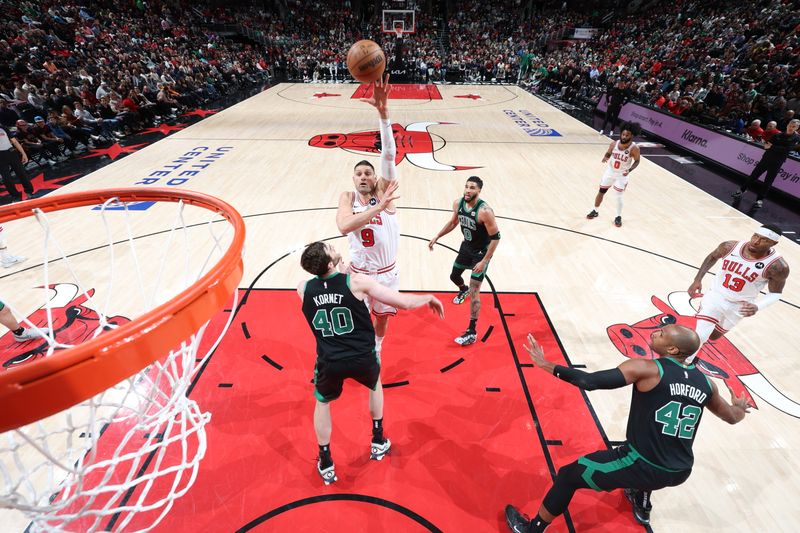 CHICAGO, IL - MARCH 23: Nikola Vucevic #9 of the Chicago Bulls shoots the ball during the game against the Boston Celtics on March 23, 2024 at United Center in Chicago, Illinois. NOTE TO USER: User expressly acknowledges and agrees that, by downloading and or using this photograph, User is consenting to the terms and conditions of the Getty Images License Agreement. Mandatory Copyright Notice: Copyright 2024 NBAE (Photo by Jeff Haynes/NBAE via Getty Images)