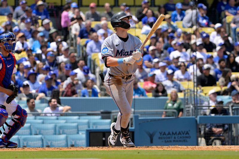Apr 30, 2025; Los Angeles, California, USA; Miami Marlins right fielder Kyle Stowers (28) hits a two-run home run against the Los Angeles Dodgers during the fourth inning at Dodger Stadium. Mandatory Credit: Jayne Kamin-Oncea-Imagn Images