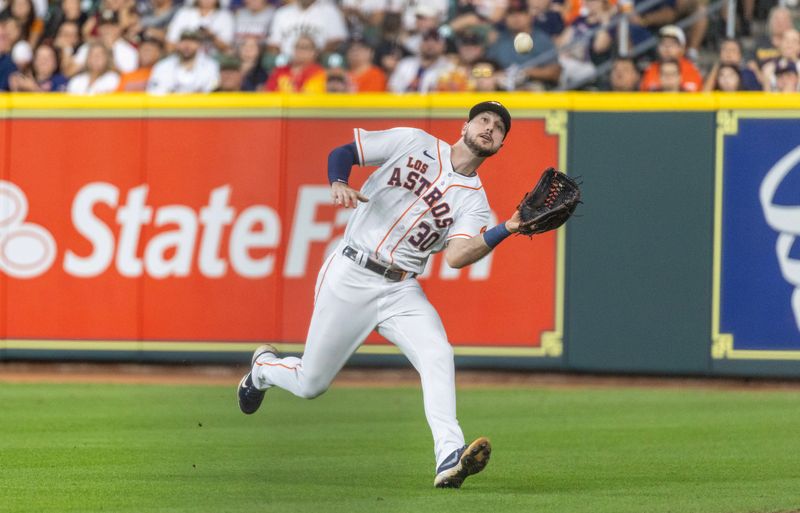 Sep 23, 2023; Houston, Texas, USA; Houston Astros right fielder Kyle Tucker (30) catches Kansas City Royals shortstop Bobby Witt Jr. (7) (not pictured) fly ball for an out in the third inning at Minute Maid Park. Mandatory Credit: Thomas Shea-USA TODAY Sports