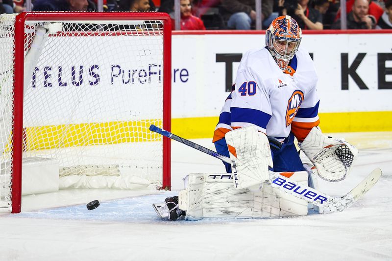 Nov 19, 2024; Calgary, Alberta, CAN; New York Islanders goaltender Semyon Varlamov (40) guards his net against the Calgary Flames during the second period at Scotiabank Saddledome. Mandatory Credit: Sergei Belski-Imagn Images