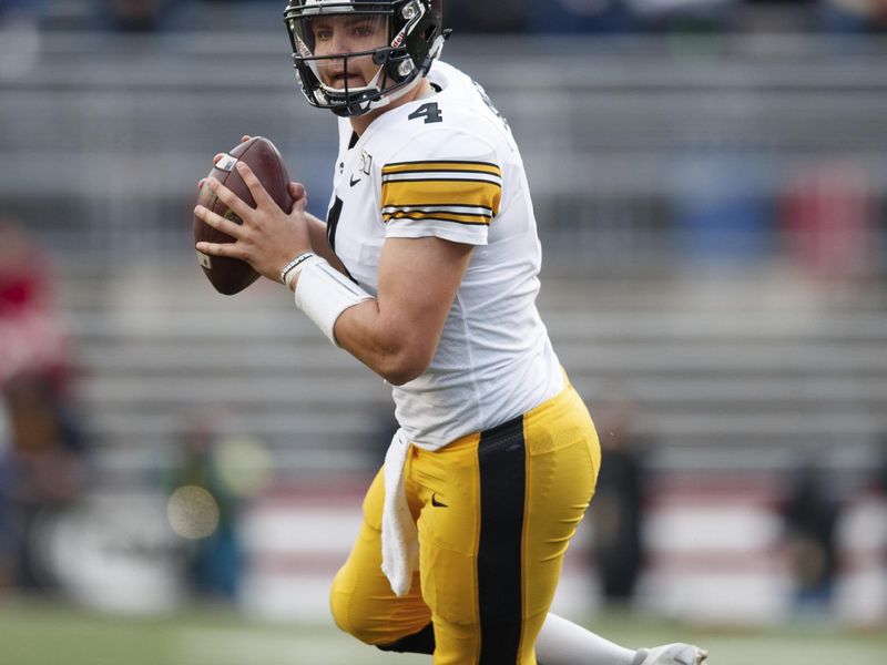 Nov 9, 2019; Madison, WI, USA; Iowa Hawkeyes quarterback Nate Stanley (4) looks to throw a pass during the first quarter against the Wisconsin Badgers at Camp Randall Stadium. Mandatory Credit: Jeff Hanisch-USA TODAY Sports