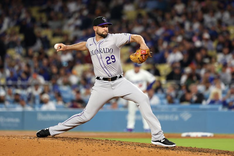 Jun 1, 2024; Los Angeles, California, USA;  Colorado Rockies relief pitcher Matt Carasiti (29) pitches during the eighth inning against the Los Angeles Dodgers at Dodger Stadium. Mandatory Credit: Kiyoshi Mio-USA TODAY Sports