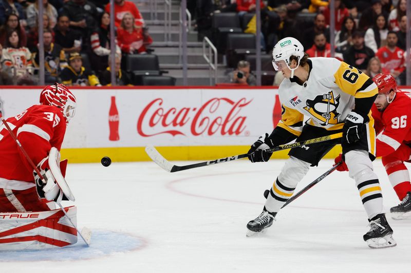 Oct 18, 2023; Detroit, Michigan, USA; Pittsburgh Penguins right wing Rickard Rakell (67) takes a shot on Detroit Red Wings goaltender Ville Husso (35) in the third period at Little Caesars Arena. Mandatory Credit: Rick Osentoski-USA TODAY Sports