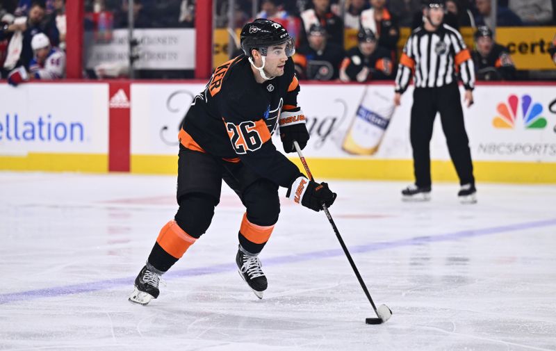 Nov 24, 2023; Philadelphia, Pennsylvania, USA; Philadelphia Flyers defenseman Sean Walker (26) controls the puck against the New York Rangers in the second period at Wells Fargo Center. Mandatory Credit: Kyle Ross-USA TODAY Sports