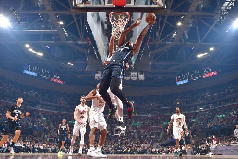 CLEVELAND, OH - FEBRUARY 22: Wendell Carter Jr. #34 of the Orlando Magic drives to the basket during the game against the Cleveland Cavaliers on February 22, 2024 at Rocket Mortgage FieldHouse in Cleveland, Ohio. NOTE TO USER: User expressly acknowledges and agrees that, by downloading and/or using this Photograph, user is consenting to the terms and conditions of the Getty Images License Agreement. Mandatory Copyright Notice: Copyright 2024 NBAE (Photo by David Liam Kyle/NBAE via Getty Images)