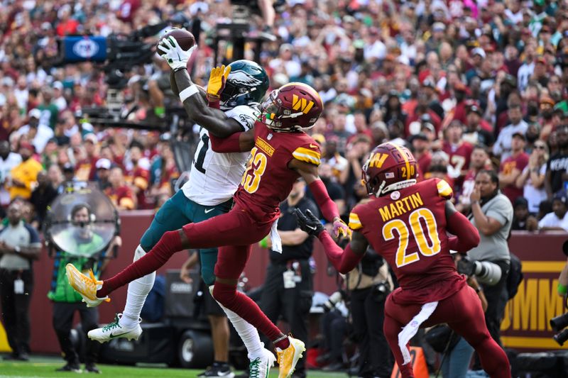 Philadelphia Eagles wide receiver A.J. Brown catches the ball against Washington Commanders cornerback Emmanuel Forbes (13) for a touchdown during the second half of an NFL football game, Sunday, Oct. 29, 2023, in Landover, Md. (AP Photo/Terrance Williams)