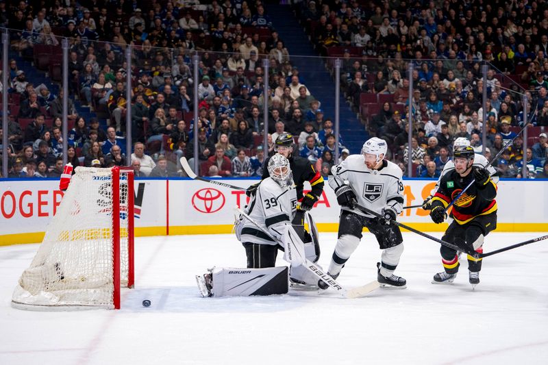 Mar 25, 2024; Vancouver, British Columbia, CAN; Vancouver Canucks forward Conor Garland (8) and forward Nils Hoglander (21) and Los Angeles Kings defenseman Vladislav Gavrikov (84) watch a shot from forward Brock Boeser (6) beat goalie Cam Talbot (39) in the third period at Rogers Arena. Kings won 3 -2. Mandatory Credit: Bob Frid-USA TODAY Sports