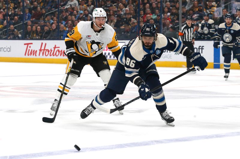 Nov 15, 2024; Columbus, Ohio, USA; Columbus Blue Jackets right wing Kirill Marchenko (86) and Pittsburgh Penguins defenseman Ryan Shea (5) chase after a loose puck during the first period at Nationwide Arena. Mandatory Credit: Russell LaBounty-Imagn Images