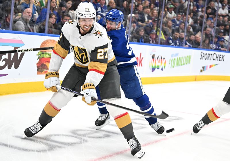 Feb 27, 2024; Toronto, Ontario, CAN;  Vegas Golden Knights defenseman Shea Theodore (27) clears the puck away from Toronto Maple Leafs forward John Tavares (91) in the third period at Scotiabank Arena. Mandatory Credit: Dan Hamilton-USA TODAY Sports