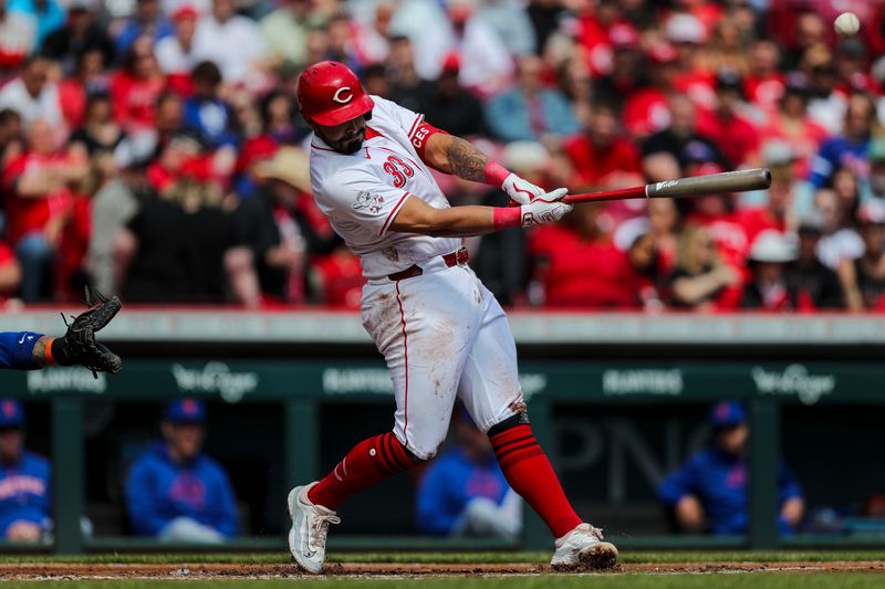 Apr 7, 2024; Cincinnati, Ohio, USA; Cincinnati Reds first baseman Christian Encarnacion-Strand (33) hits a single against the New York Mets in the first inning at Great American Ball Park. Mandatory Credit: Katie Stratman-USA TODAY Sports