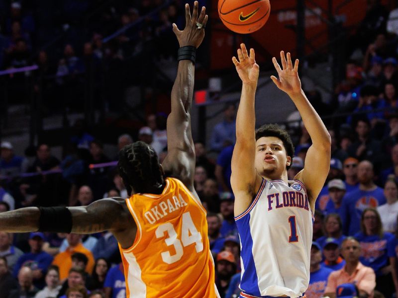 Jan 7, 2025; Gainesville, Florida, USA; Florida Gators guard Walter Clayton Jr. (1) shoots over Tennessee Volunteers forward Felix Okpara (34) during the second half at Exactech Arena at the Stephen C. O'Connell Center. Mandatory Credit: Matt Pendleton-Imagn Images