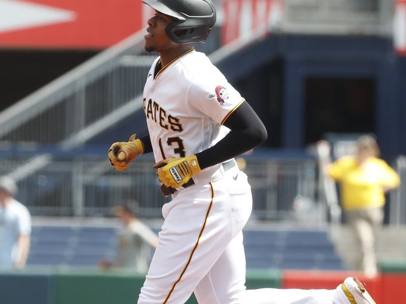 Sep 6, 2023; Pittsburgh, Pennsylvania, USA;  Pittsburgh Pirates third baseman Ke'Bryan Hayes (13) circles the bases on a solo home run against the Milwaukee Brewers during the first inning at PNC Park. Mandatory Credit: Charles LeClaire-USA TODAY Sports