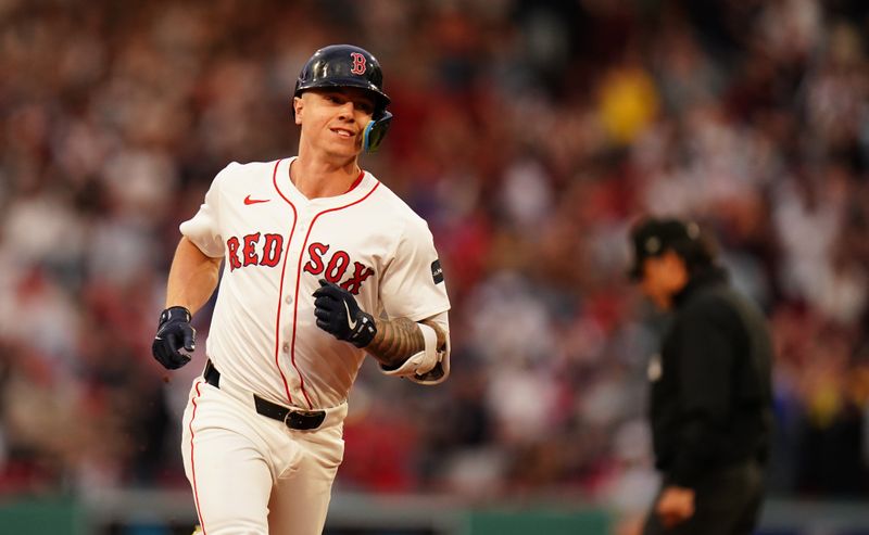 May 13, 2024; Boston, Massachusetts, USA; Boston Red Sox designated hitter Tyler O'Neill (17) hits a three run home run against the Tampa Bay Rays in the first inning at Fenway Park. Mandatory Credit: David Butler II-USA TODAY Sports