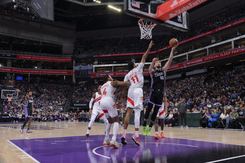 SACRAMENTO, CA - JANUARY 5: Domantas Sabonis #10 of the Sacramento Kings shoots the ball during the game against the Toronto Raptors on January 5, 2024 at Golden 1 Center in Sacramento, California. NOTE TO USER: User expressly acknowledges and agrees that, by downloading and or using this Photograph, user is consenting to the terms and conditions of the Getty Images License Agreement. Mandatory Copyright Notice: Copyright 2024 NBAE (Photo by Rocky Widner/NBAE via Getty Images)