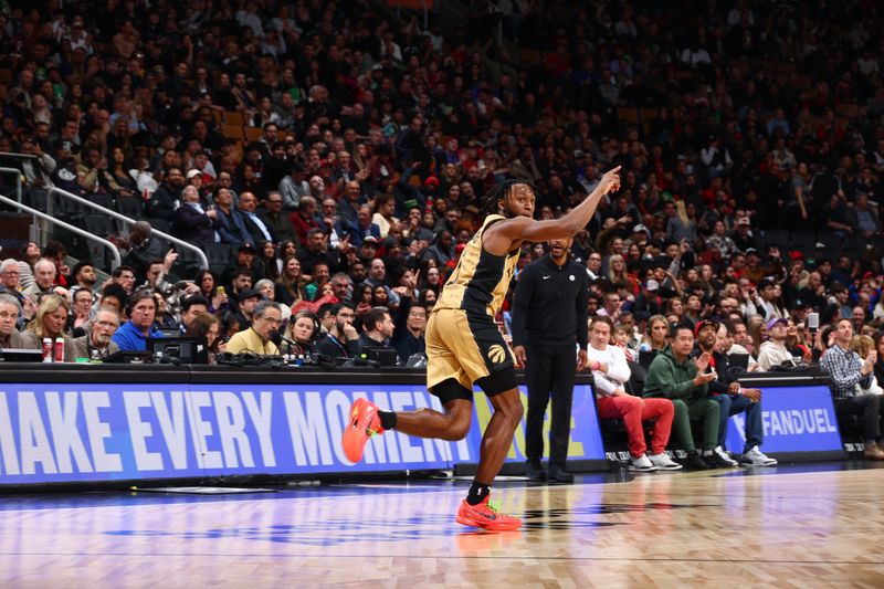 TORONTO, CANADA - FEBRUARY 22: Immanuel Quickley #5 of the Toronto Raptors celebrates during the game against the Brooklyn Nets on February 22, 2024 at the Scotiabank Arena in Toronto, Ontario, Canada.  NOTE TO USER: User expressly acknowledges and agrees that, by downloading and or using this Photograph, user is consenting to the terms and conditions of the Getty Images License Agreement.  Mandatory Copyright Notice: Copyright 2024 NBAE (Photo by Vaughn Ridley/NBAE via Getty Images)