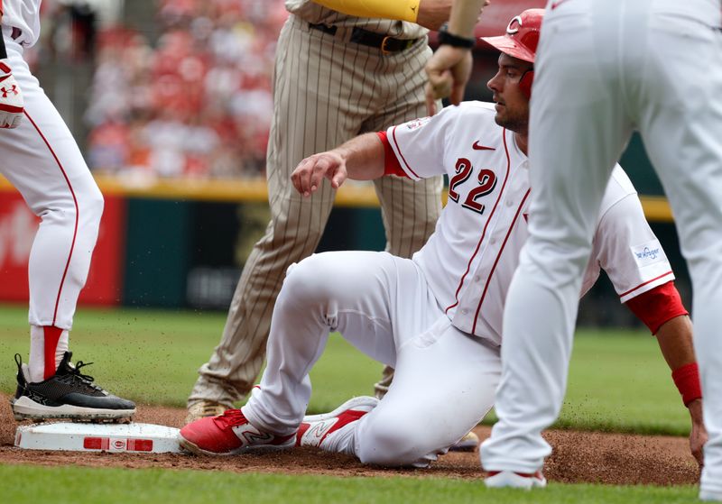 Jul 2, 2023; Cincinnati, Ohio, USA; Cincinnati Reds catcher Luke Maile (22) reaches safely back to third base against the San Diego Padres during the third inning at Great American Ball Park. Mandatory Credit: David Kohl-USA TODAY Sports