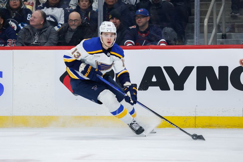 Feb 27, 2024; Winnipeg, Manitoba, CAN; St. Louis Blues forward Alexey Toropchenko (13) skates into the Winnipeg Jets during the first period at Canada Life Centre. Mandatory Credit: Terrence Lee-USA TODAY Sports