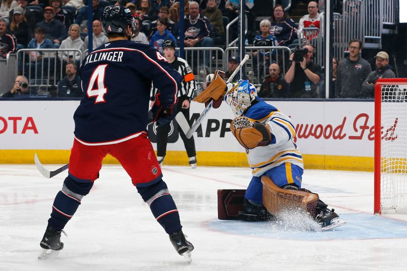 Oct 17, 2024; Columbus, Ohio, USA; Buffalo Sabres goalie Devon Levi (27) makes a save as Columbus Blue Jackets center Cole Sillinger (4) looks for a rebound during the second period at Nationwide Arena. Mandatory Credit: Russell LaBounty-Imagn Images