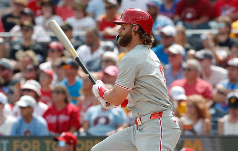 Jul 21, 2024; Pittsburgh, Pennsylvania, USA;  Philadelphia Phillies first baseman Bryce Harper (3) drives in a run on a fielders choice against the Pittsburgh Pirates during the seventh inning at PNC Park. The Phillies won 6-0. Mandatory Credit: Charles LeClaire-USA TODAY Sports