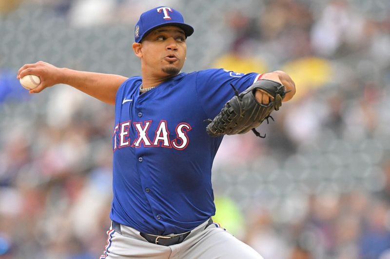 May 26, 2024; Minneapolis, Minnesota, USA;  Texas Rangers pitcher Gerson Garabito (58) delivers a pitch against the Minnesota Twins during the first inning at Target Field. Mandatory Credit: Nick Wosika-USA TODAY Sports