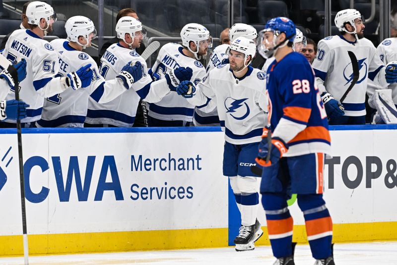 Feb 8, 2024; Elmont, New York, USA; Tampa Bay Lightning left wing Brandon Hagel (38) celebrates his goal against the New York Islanders with the Tampa Bay Lightning bench during the second period at UBS Arena. Mandatory Credit: Dennis Schneidler-USA TODAY Sports