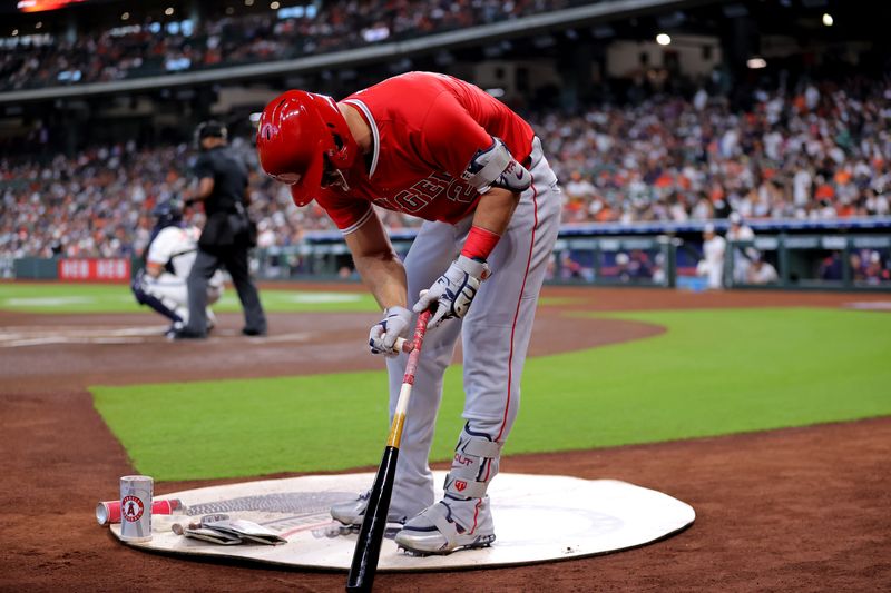 Apr 13, 2025; Houston, Texas, USA; Los Angeles Angels designated hitter Mike Trout (27) in the on-deck circle against the Houston Astros during the first inning at Daikin Park. Mandatory Credit: Erik Williams-Imagn Images