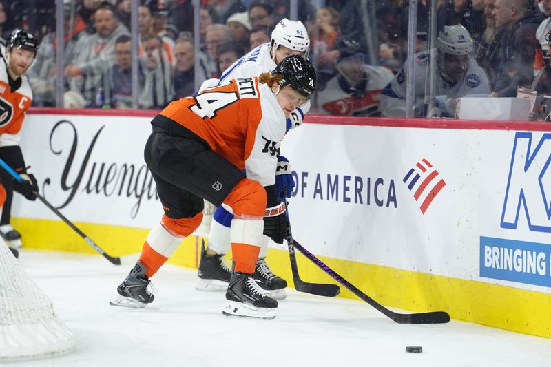 Jan 12, 2026; Philadelphia, Pennsylvania, USA; Philadelphia Flyers right wing Owen Tippett (74) and Tampa Bay Lightning defenseman Erik Cernak (81) battle for the puck in the first period at Xfinity Mobile Arena. Mandatory Credit: Kyle Ross-Imagn Images