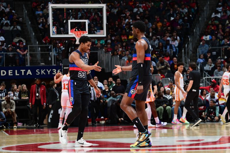 ATLANTA, GA - APRIL 3: Jaden Ivey #23 of the Detroit Pistons high fives Chimezie Metu #5 of the Detroit Pistons during the game against the Atlanta Hawks on April 3, 2024 at State Farm Arena in Atlanta, Georgia.  NOTE TO USER: User expressly acknowledges and agrees that, by downloading and/or using this Photograph, user is consenting to the terms and conditions of the Getty Images License Agreement. Mandatory Copyright Notice: Copyright 2024 NBAE (Photo by Scott Cunningham/NBAE via Getty Images)