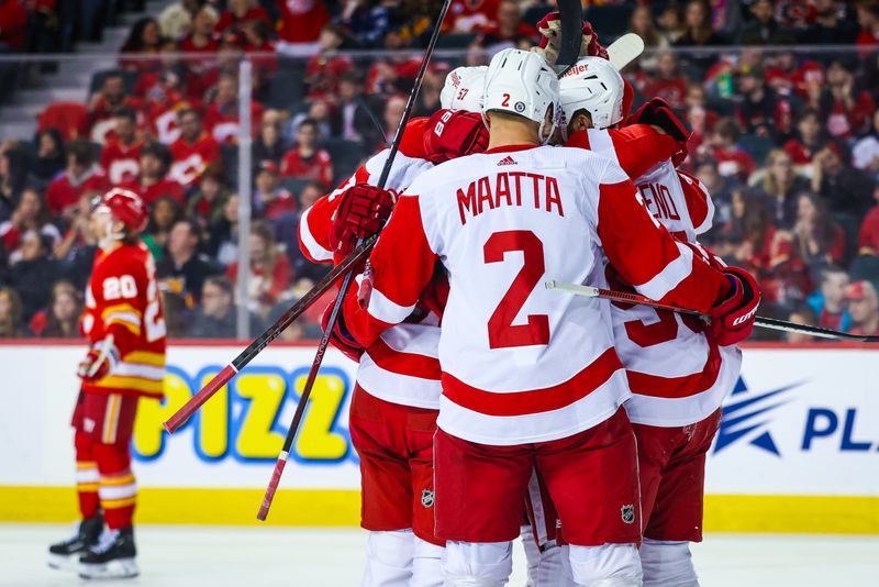 Feb 17, 2024; Calgary, Alberta, CAN; Detroit Red Wings left wing David Perron (57) celebrates his goal with teammates against the Calgary Flames during the second period at Scotiabank Saddledome. Mandatory Credit: Sergei Belski-USA TODAY Sports