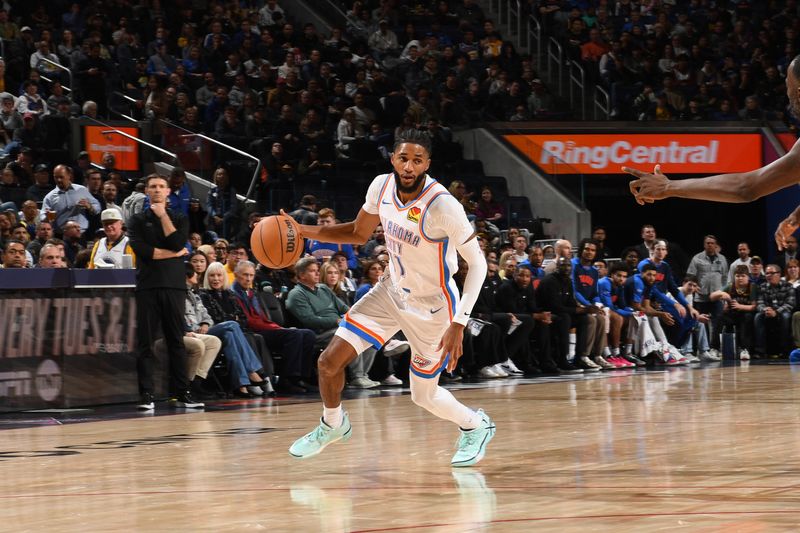 SAN FRANCISCO, CA - NOVEMBER 27: Isaiah Joe #11 of the Oklahoma City Thunder dribbles the ball during the game against the Golden State Warriors on November 27, 2024 at Chase Center in San Francisco, California. NOTE TO USER: User expressly acknowledges and agrees that, by downloading and or using this photograph, user is consenting to the terms and conditions of Getty Images License Agreement. Mandatory Copyright Notice: Copyright 2024 NBAE (Photo by Noah Graham/NBAE via Getty Images)