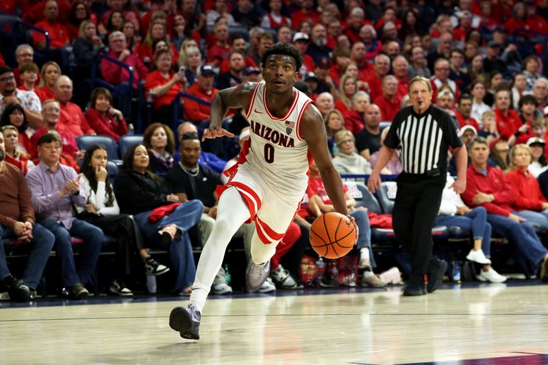 Feb 17, 2024; Tucson, Arizona, USA; Arizona Wildcats guard Jaden Bradley (0) drives to the net against the Arizona State Sun Devils during the second half at McKale Center. Mandatory Credit: Zachary BonDurant-USA TODAY Sports