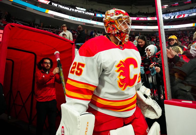 Mar 10, 2024; Raleigh, North Carolina, USA;  Calgary Flames goaltender Jacob Markstrom (25) goes past the fans on his way to the warmups before the game against the Carolina Hurricanes at PNC Arena. Mandatory Credit: James Guillory-USA TODAY Sports