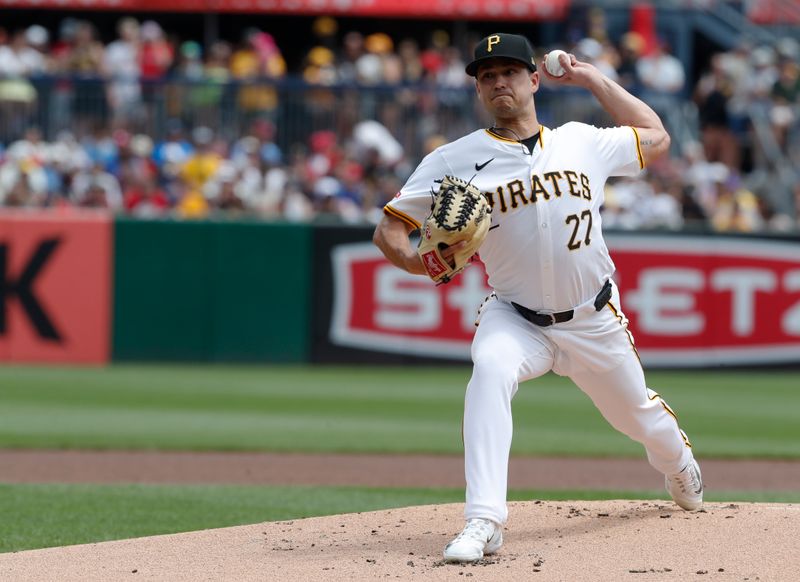 Jul 21, 2024; Pittsburgh, Pennsylvania, USA;  Pittsburgh Pirates starting pitcher Marco Gonzales (27) delivers a pitch against the Philadelphia Phillies during the first inning at PNC Park. Mandatory Credit: Charles LeClaire-USA TODAY Sports