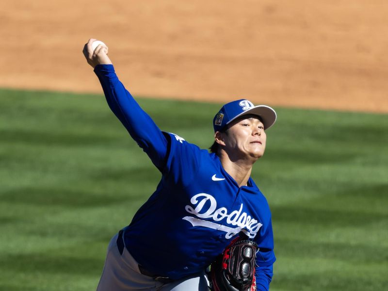 Feb 21, 2026; Tempe, Arizona, USA; Los Angeles Dodgers pitcher Yoshinobu Yamamoto against the Los Angeles Angels during a spring training game at Tempe Diablo Stadium. Mandatory Credit: Mark J. Rebilas-Imagn Images