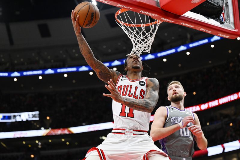 CHICAGO, ILLINOIS - MARCH 15: DeMar DeRozan #11 of the Chicago Bulls shoots in the first half of the game against Domantas Sabonis #10 of the Sacramento Kings at United Center on March 15, 2023 in Chicago, Illinois.   NOTE TO USER: User expressly acknowledges and agrees that, by downloading and or using this photograph, User is consenting to the terms and conditions of the Getty Images License Agreement.  (Photo by Quinn Harris/Getty Images)
