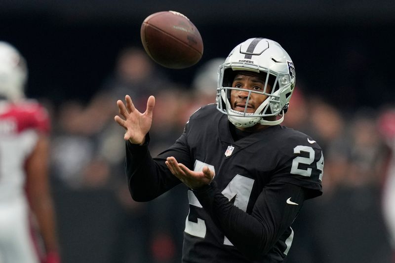 Las Vegas Raiders safety Johnathan Abram (24) warms up before an NFL football game against the Arizona Cardinals, Sunday, Sept. 18, 2022, in Las Vegas. (AP Photo/John Locher)