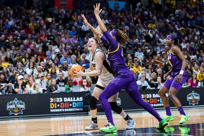 Apr 2, 2023; Dallas, TX, USA; Iowa Hawkeyes forward Monika Czinano (25) drives to the basket against LSU Lady Tigers forward LaDazhia Williams (0) in the second half during the final round of the Women's Final Four NCAA tournament at the American Airlines Center. Mandatory Credit: Kevin Jairaj-USA TODAY Sports