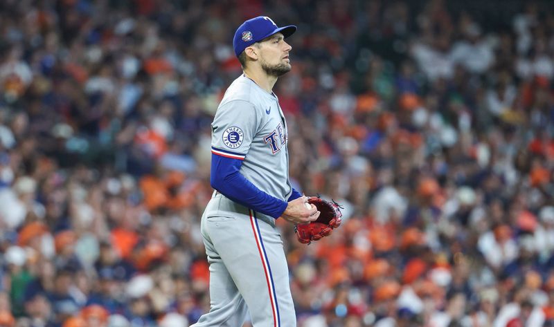 Apr 14, 2024; Houston, Texas, USA; Texas Rangers pitcher Nathan Eovaldi (17) looks up after a play during the fourth inning against the Houston Astros at Minute Maid Park. Mandatory Credit: Troy Taormina-USA TODAY Sports