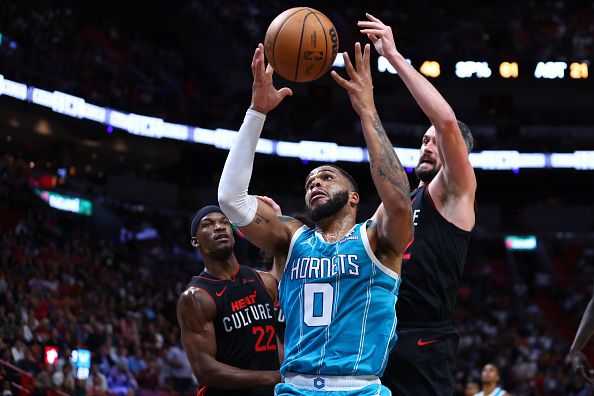 MIAMI, FLORIDA - DECEMBER 13: Miles Bridges #0 of the Charlotte Hornets rebounds the ball during the third quarter of the game aMiami Heat at Kaseya Center on December 13, 2023 in Miami, Florida. NOTE TO USER: User expressly acknowledges and agrees that, by downloading and or using this photograph, User is consenting to the terms and conditions of the Getty Images License Agreement. (Photo by Megan Briggs/Getty Images)