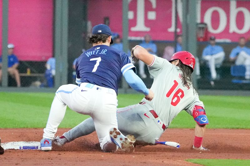 Aug 23, 2024; Kansas City, Missouri, USA; Kansas City Royals shortstop Bobby Witt Jr. (7) can’t make the tag as Philadelphia Phillies designated hitter Kyle Schwarber (12) reaches second safely in the third inning at Kauffman Stadium. Mandatory Credit: Denny Medley-USA TODAY Sports