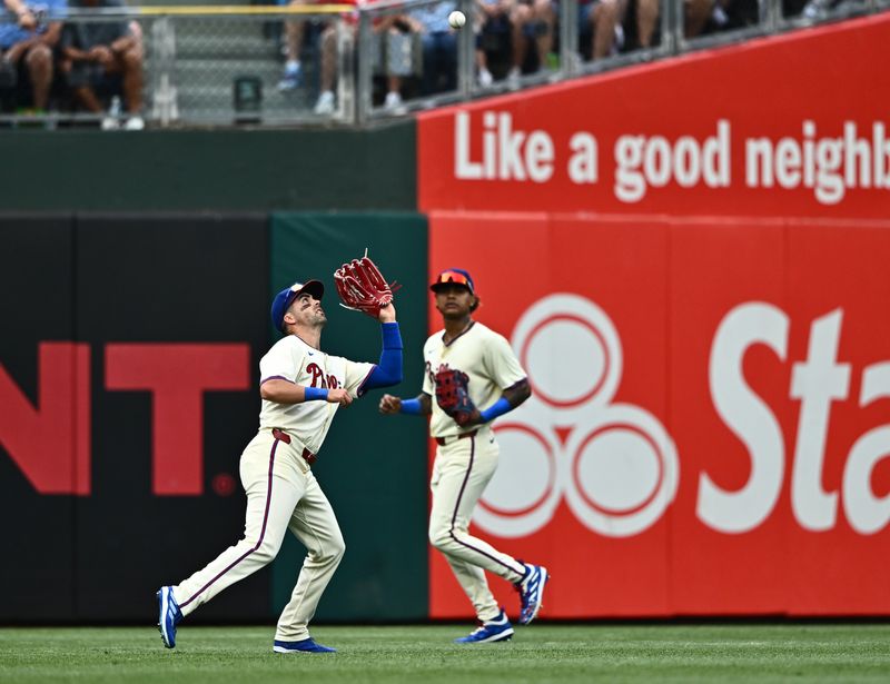 Jun 5, 2024; Philadelphia, Pennsylvania, USA; Philadelphia Phillies outfielder Whit Merrifield (9) fields a fly ball against the Milwaukee Brewers in the fourth inning at Citizens Bank Park. Mandatory Credit: Kyle Ross-USA TODAY Sports