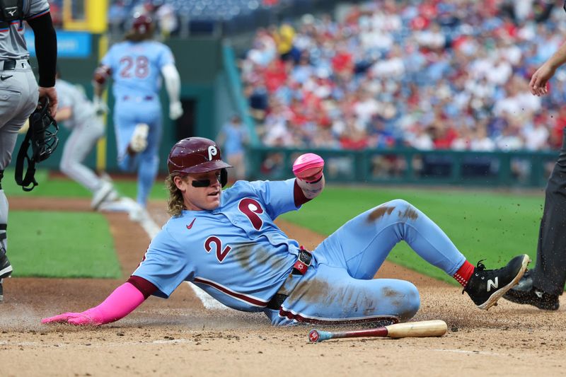 Sep 25, 2025; Philadelphia, Pennsylvania, USA; Philadelphia Phillies outfielder Harrison Bader (2) slides home for a run against the Miami Marlins during the first inning at Citizens Bank Park. Mandatory Credit: Bill Streicher-Imagn Images