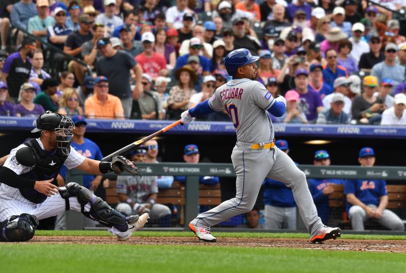 May 28, 2023; Denver, Colorado, USA; New York Mets second baseman Eduardo Escobar (10) singles in the fourth inning against the Colorado Rockies at Coors Field. Mandatory Credit: John Leyba-USA TODAY Sports