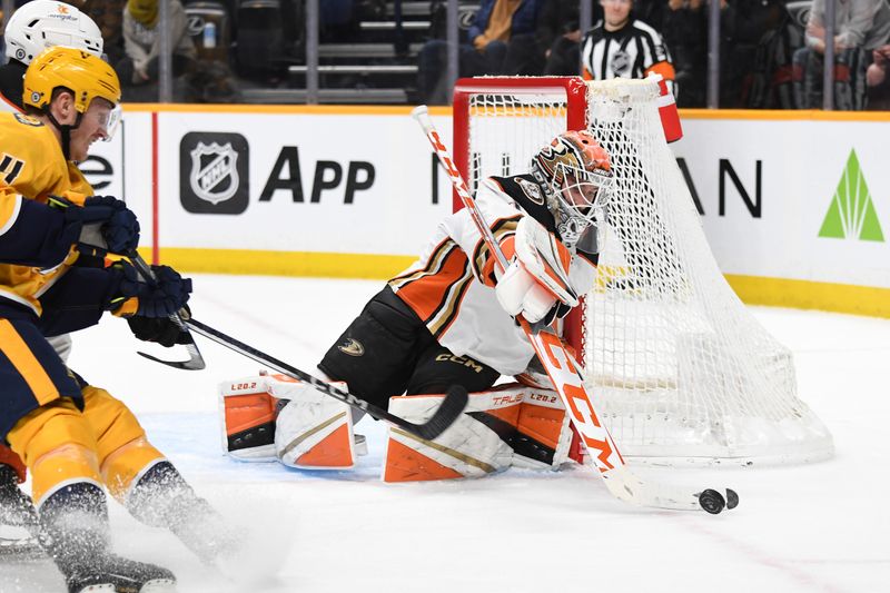 Jan 9, 2024; Nashville, Tennessee, USA; Anaheim Ducks goaltender Lukas Dostal (1) makes a save at the side of the net during the third period against the Nashville Predators at Bridgestone Arena. Mandatory Credit: Christopher Hanewinckel-USA TODAY Sports