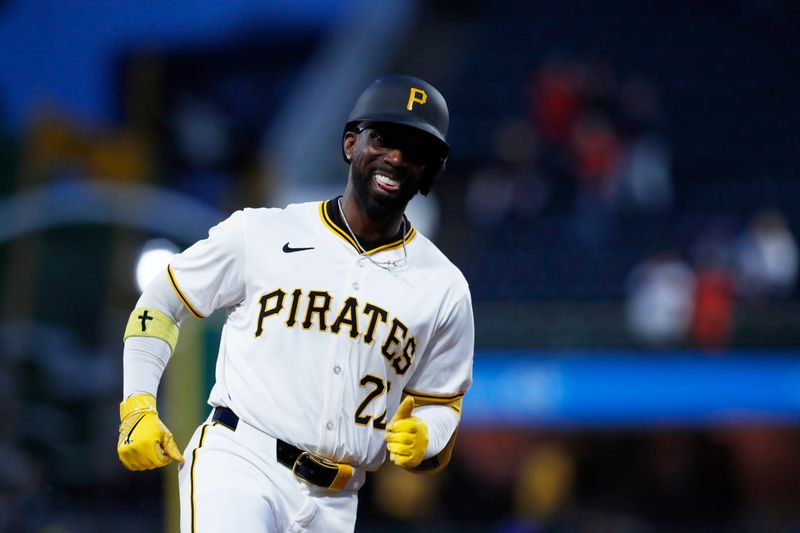 May 11, 2024; Pittsburgh, Pennsylvania, USA; Pittsburgh Pirates designated hitter Andrew McCutchen (22) runs the bases after hitting a solo home run against the Chicago Cubs during the sixth inning at PNC Park. Mandatory Credit: Charles LeClaire-USA TODAY Sports