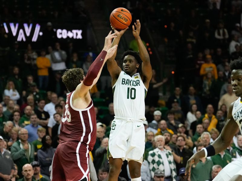 Feb 8, 2023; Waco, Texas, USA;  Baylor Bears guard Adam Flagler (10) scores a three point basket over Oklahoma Sooners forward Tanner Groves (35) during the second half at Ferrell Center. Mandatory Credit: Chris Jones-USA TODAY Sports